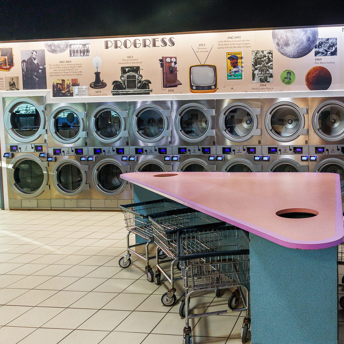 Interior of Showcase Laundromat in Clifton, NJ, with rows of washers and dryers