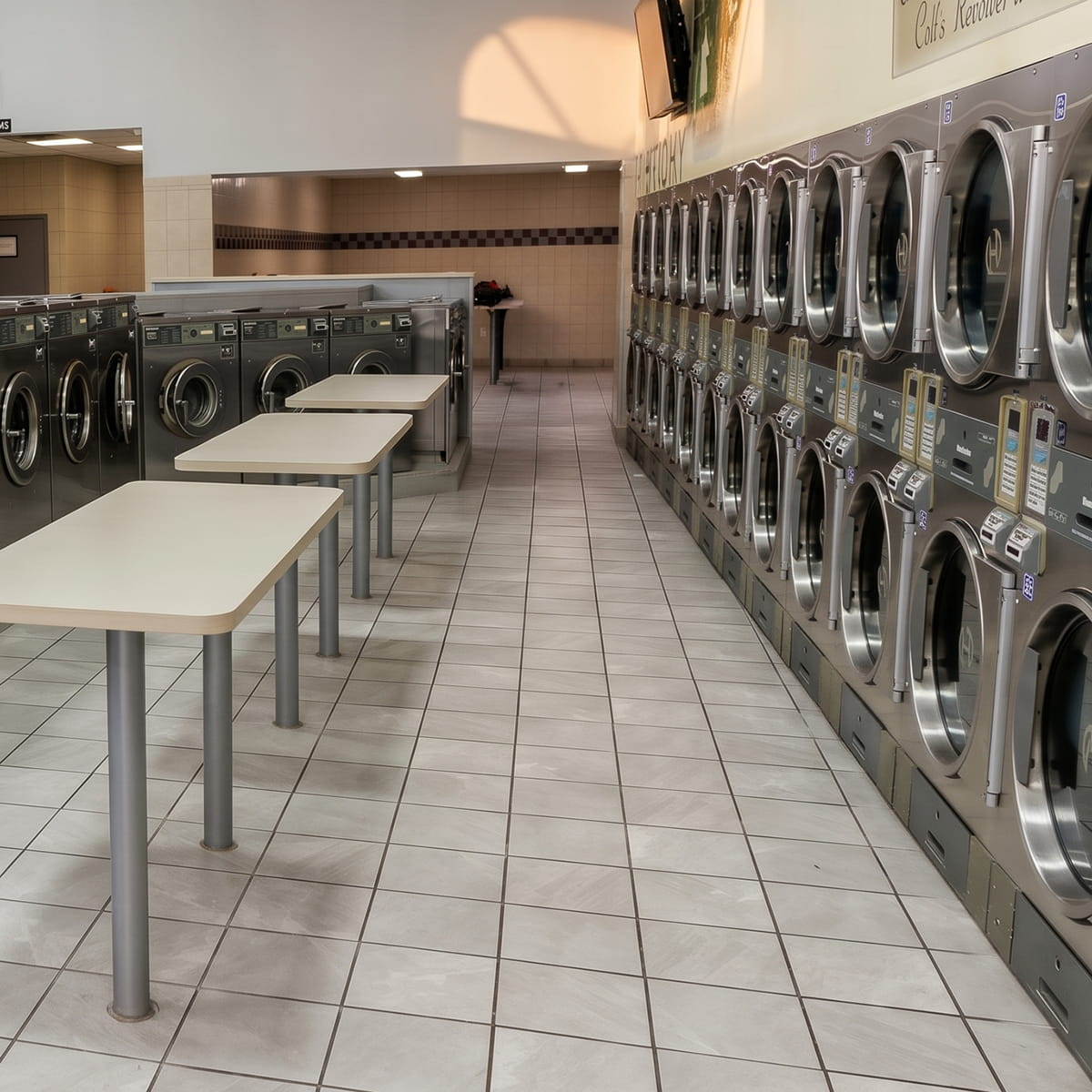 Interior of Showcase Laundromat in Paterson, NJ, with rows of washers and dryers